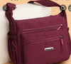 Durable Nylon Fabric women Crossbody bag with Multi pockets in wine Colour